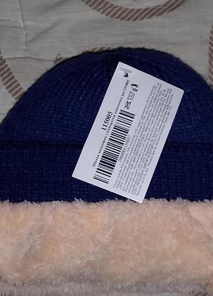 Новая очень теплая шапка мужская цвет синий 
с мехом высылаю по украине