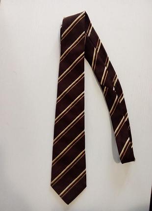 Краватка в смужку коричнева