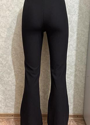 Штани клеш у рубчик