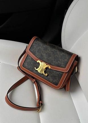 Брендована шкіряна сумочка коричневого кольору 🤎