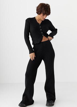 Трикотажный костюм в рубчик с кардиганом и брюками палаццо