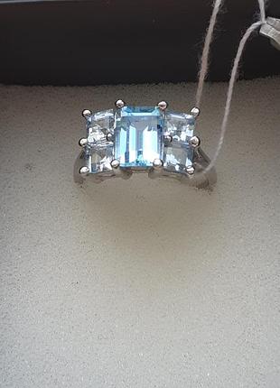 Срібна каблучка із блакитним топазом