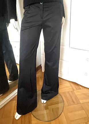 Брюки клешені