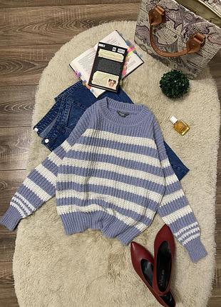 Смугастий вʼязаний светр