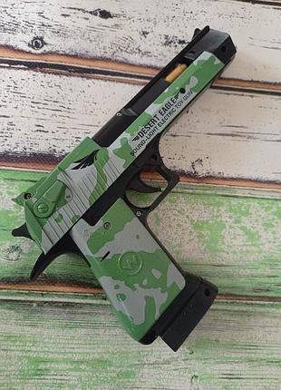 Іграшковий пістолет