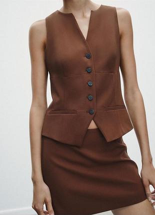 Жилетка на гудзиках