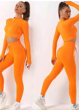 Яркий костюм для фитнеса оранжевый топ лосины в рубчик prettylittlethings