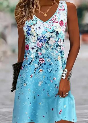 Женское элегантное безрукавное платье с цветочным принтом - ярко-голубое с пеплумом