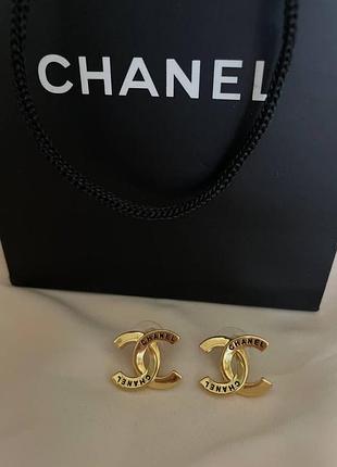 Сережки ціяшки в позолоті у вигляді логотипу