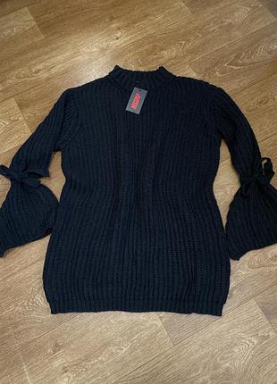 Продам вʼязану сукню - туніку з високим коміром та завʼязками на рукавах ( мʼякенький та гарно тягнеться)