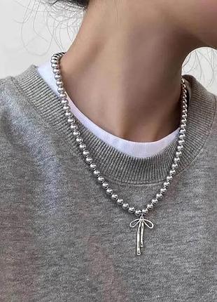 Украшение ожерелье с кулоном бантом