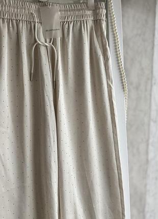 Білі шовкові штани широкі в стразах висока посадка