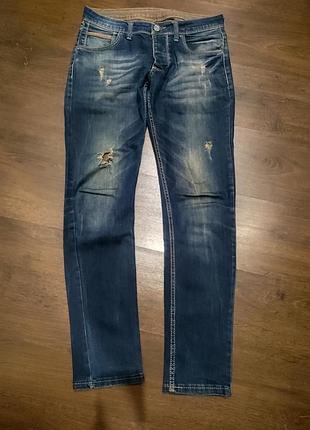 Джинсы рваные