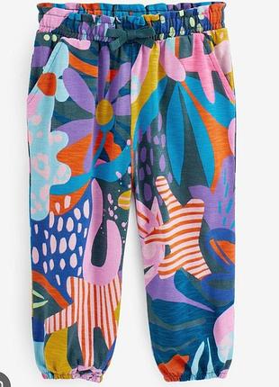 Яркие штанишки на девочку в цветочек next 4-5 лет