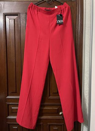 Нові жіночі широкі брюки zara червоного кольору