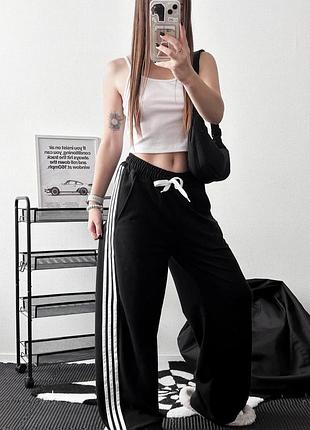 Широкі штани з лампасами, талія регулюється за допомогою шнурків