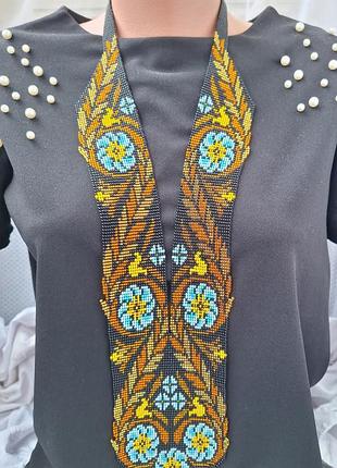 Гердан из бисера с цветами и колышками hand made