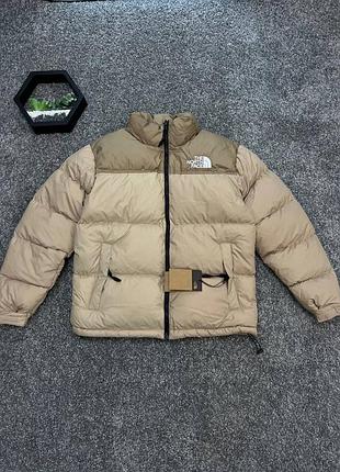 Пуховик бежевий the north face