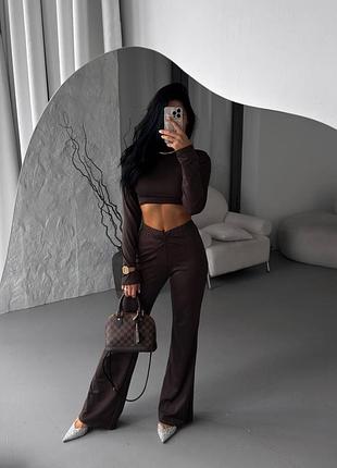 Стильний костюм топ з довгими рукавами та штани палаццо