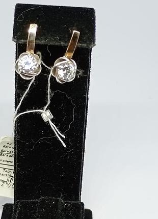Серебряные серьги с фианитом и золотыми накладками.