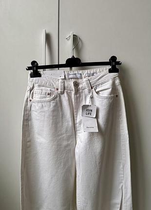 Нові білі джинси