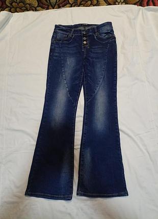 Джинсы женские с эффектом потертости размер 30.