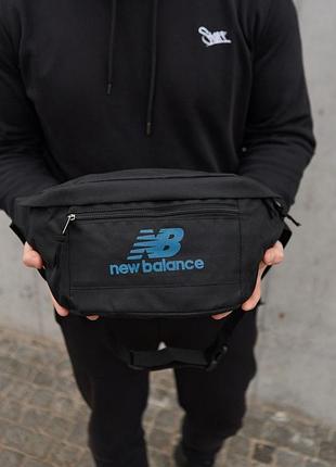 Поясная сумка бананка new balance черная с логотипом синего цвета tsh2