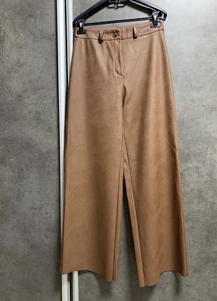 Штани шкіряні, високі брюки