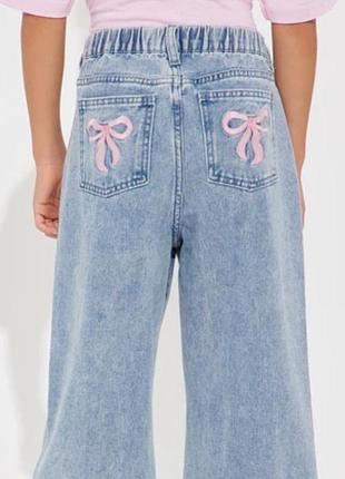 Джинсы с бантиками