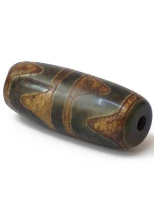 Бусина дзі коричнева зуб тигра дає своєму власнику силу волі та завзятість