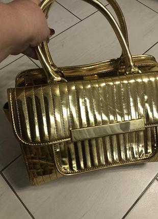 Стильная золотая сумка ted baker