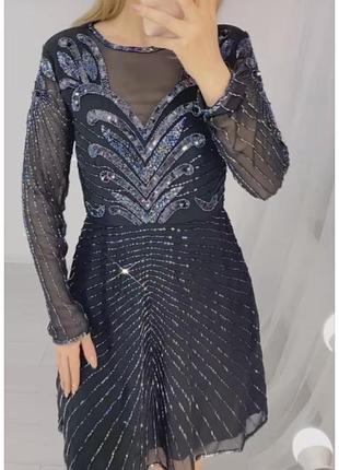 Сукня чорна коктельна з довгими прозорими рукавами прикрашена бісером та паєтками