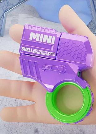 Игрушечный мини-пистолет спиннер с пластиковыми пулями фиолетовый