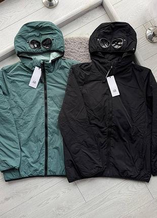 Микропуховик cp company goggle jacket