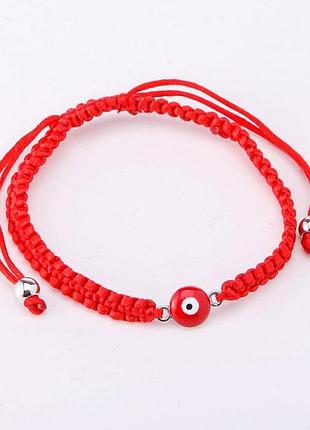 Червона нитка з оберегом турецький око
