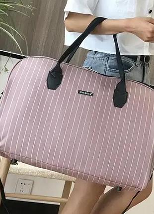 Дорожная сумка женская с ручками розовая с плечевым ремнем непромокаемая 36 литров