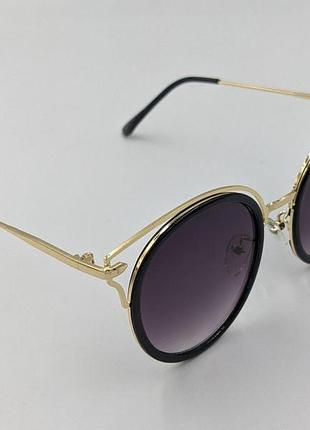 Сонцезахисні окуляри 8356 50 24-138 c-1 aedoll — стильні окуляри в круглій оправі із золотистими елементами.
