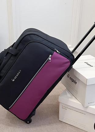 Жіноча дорожня сумка на колесах із телескопічною ручкою 40 літрів фіолетова