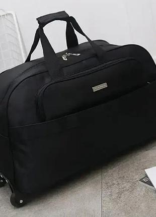 Дорожня сумка з колесами 55 літрів металева містка водонепроникна на колесах із телескопічною ручкою