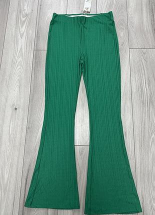 Штани кльош зелені у смужку на резинці лосіни