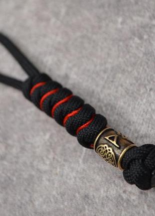 Брелок-оберег с руной вуньо из бронзы ручного литья, паракорд