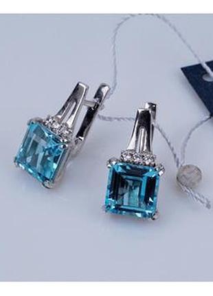 Серьги серебряные с голубыми топазами 925 пробы.