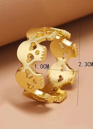 Каблучка з черепами золотистого кольору, 17 розмір
