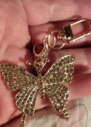 Брелок на ключи сумку золотистый металл крупная бабочка в камнях камни