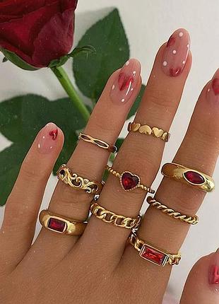 Комплект з 9 золотистих каблучок