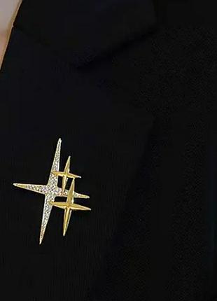 Брошка брошка виблискує зірки золотистий метал білі камені