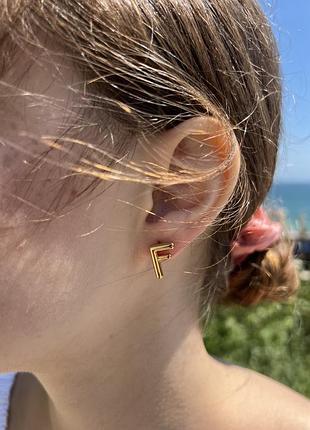 Сережки з логотипом позолота
