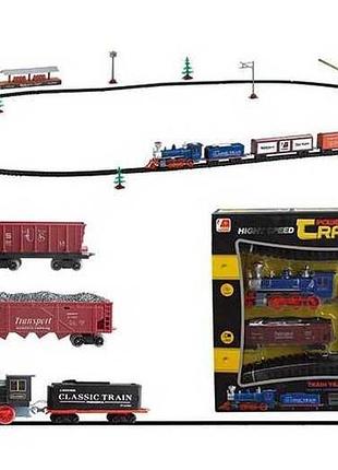 Игрушка железная дорога 3019 а (18) на батарейках, 76 деталей, локомотив со светом и звуком, вагон,