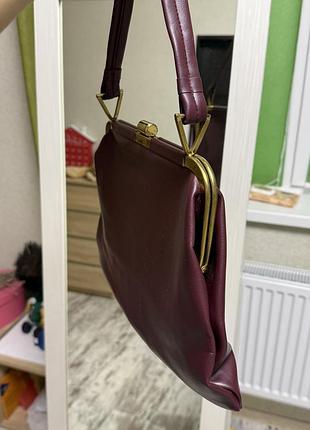 Бордова сумка на фермуарі