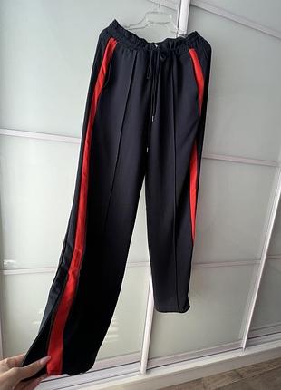 Темно сині палаццо на резинці з застібками внизу